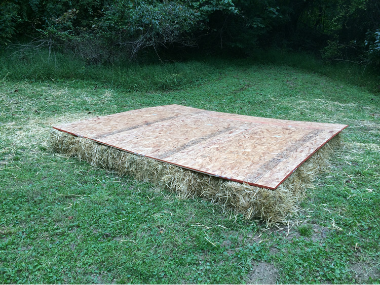 img src="onelayer_raw.png" alt"straw stage with plywood in a grassy hollar">
