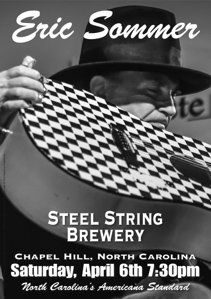 img src="SteelString46.png" singer with vivian westwood hat hugs checker guitar">